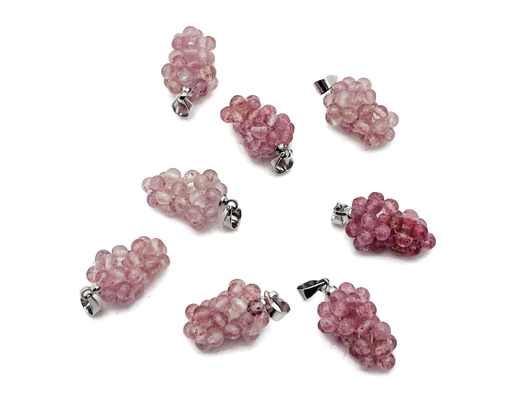 Strawberry Quartz Grape Crystal Pendant from GemstoneGO featuring a detailed crystal grape cluster design.