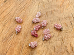 Strawberry Quartz Grape Crystal Pendant by GemstoneGO featuring a vibrant crystal grape design on a silver chain.