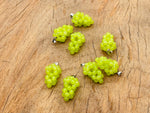 Green agate and grape-shaped crystal pendant from GemstoneGO featuring vibrant green stones and detailed grape design.