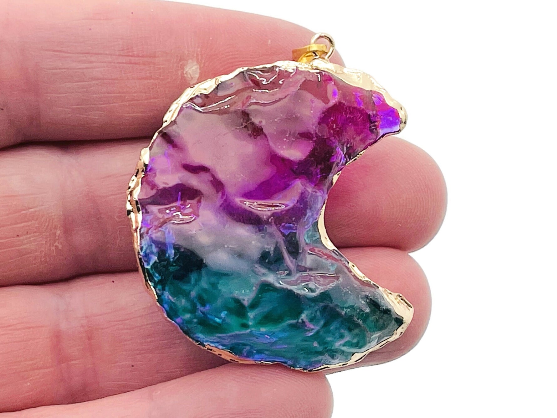 Blue and purple Rainbow Aura Moon crystal pendant with love stone design by GemstoneGO, showcasing its vibrant, iridescent finish.