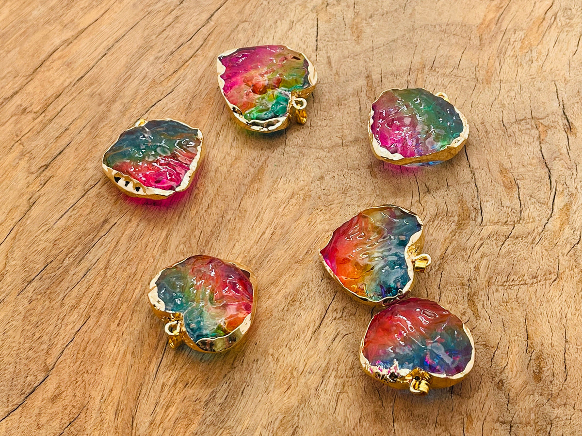 Rainbow Aura Heart crystal pendant with pink, yellow, and blue hues, featuring a loose gemstone from GemstoneGO.