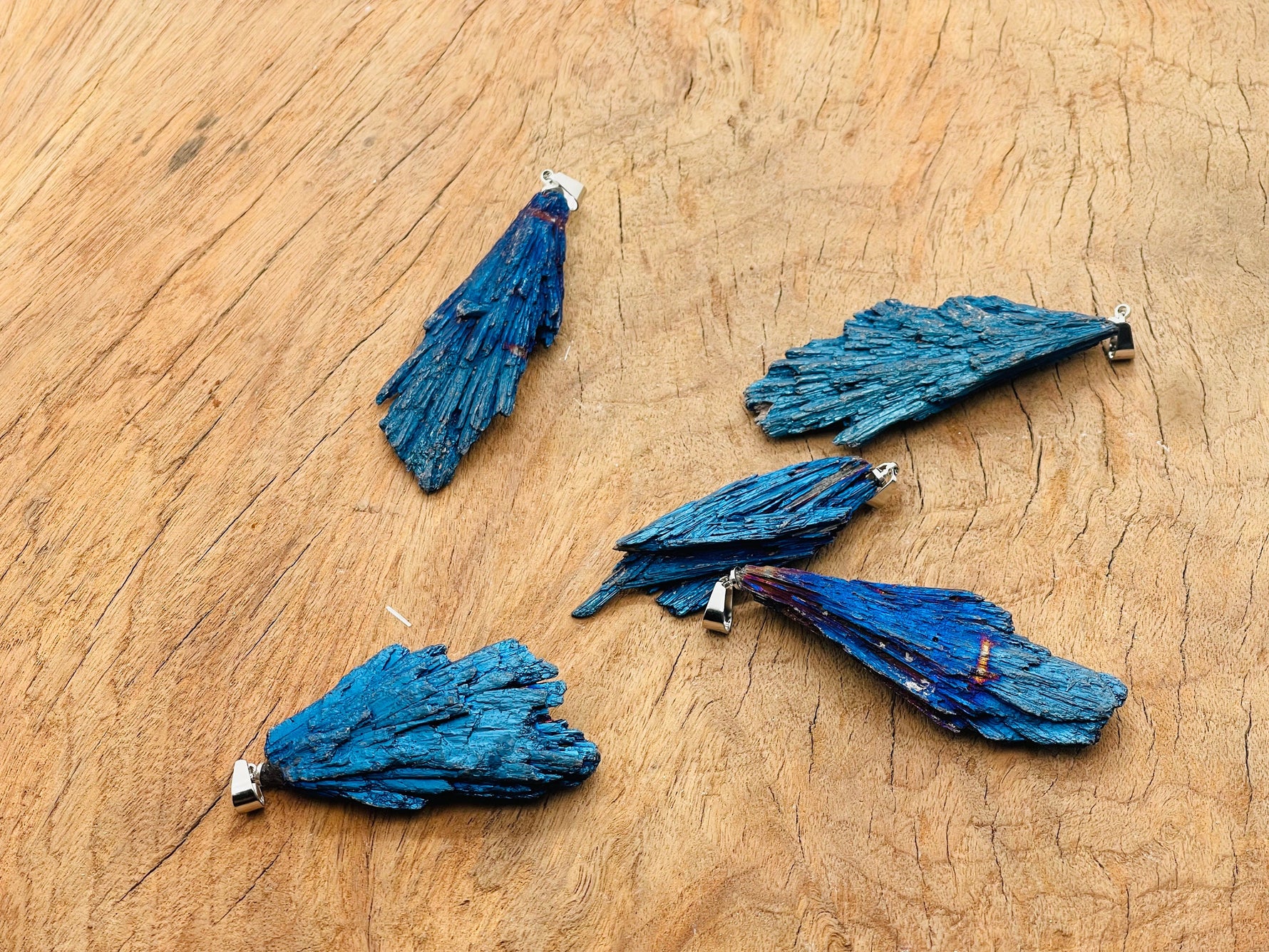 Blue Kyanite fan crystal pendant from GemstoneGO featuring a vibrant blue, fan-shaped gemstone set in a silver pendant.