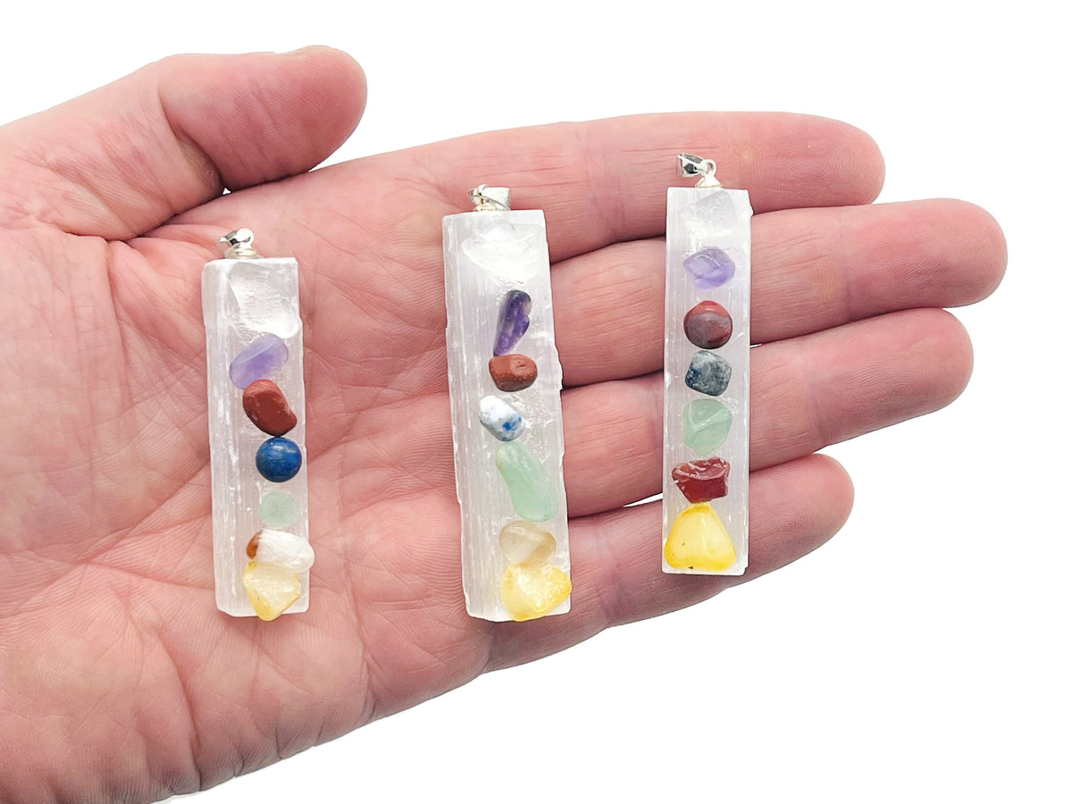 Chakra Selenite sticks pendant from GemstoneGO featuring a clear crystal healing pendant with a silver bail, on a white background.