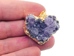 Amethyst heart cluster crystal pendant from GemstoneGO featuring a purple gemstone heart with natural crystal points on a silver chain