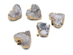 Quartz heart cluster crystal pendant from GemstoneGO featuring a polished heart-shaped quartz crystal with natural facets.