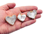Quartz Heart Cluster Crystal Pendant by GemstoneGO featuring a polished quartz heart-shaped cluster with a silver bail.