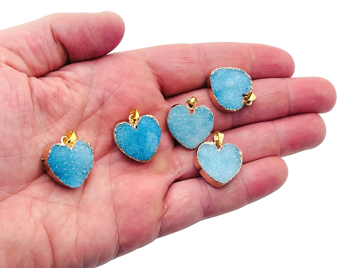 Blue Agate Heart Geode Druzy Crystal Pendant showing a vibrant blue agate heart with sparkling druzy interior, jewelry pendant.
