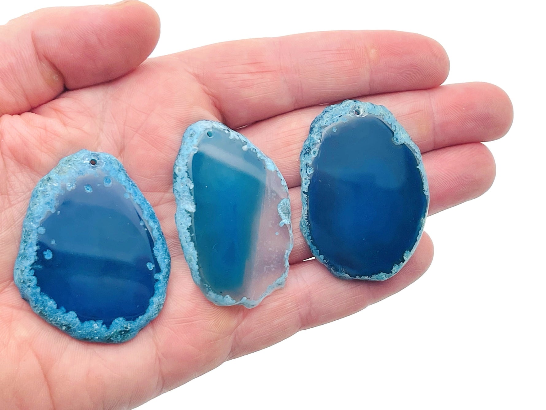 Blue Agate slice drilled pendant with hole, natural gemstone for jewelry making, showcasing vibrant blue and white banding.