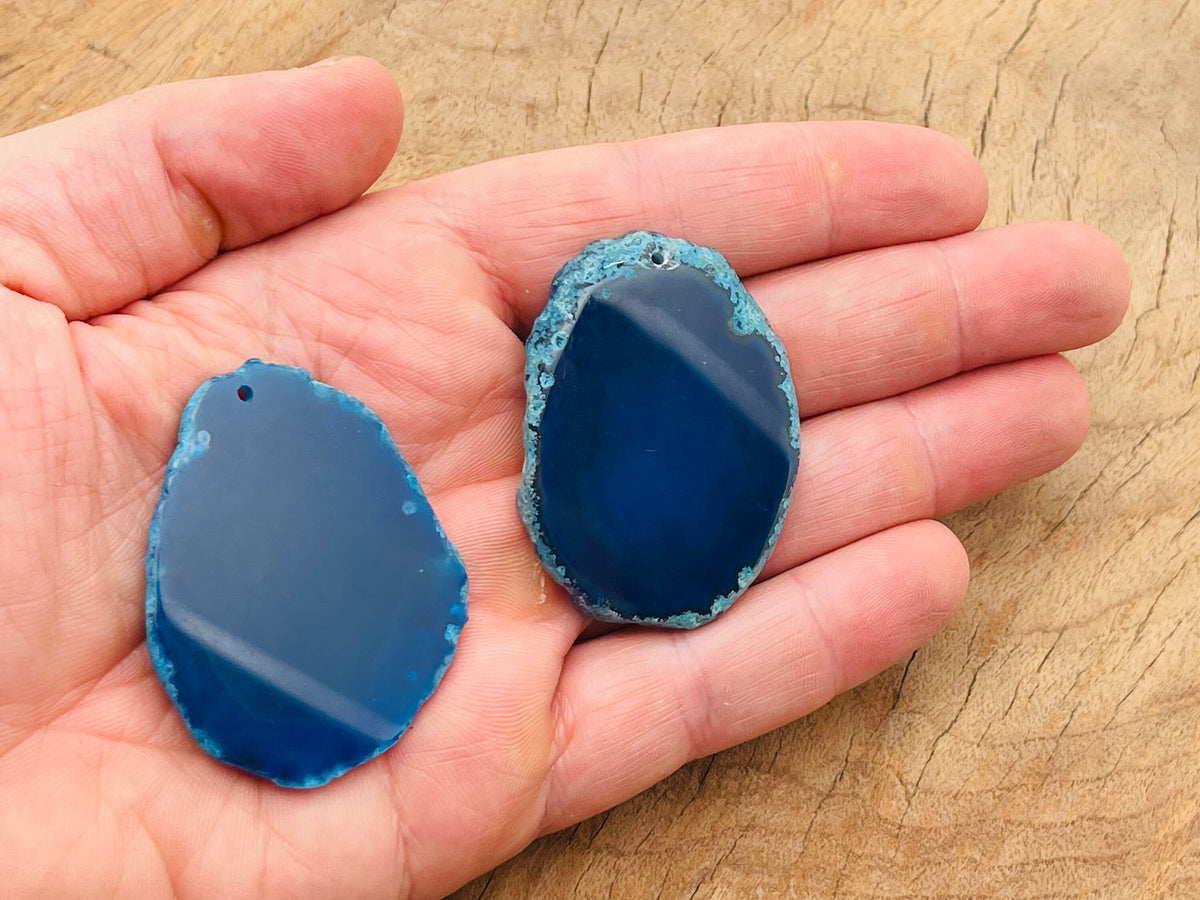 Blue Agate Slice drilled pendant, showing vibrant blue agate with natural banding, ideal for jewelry making and gemstone crafts.