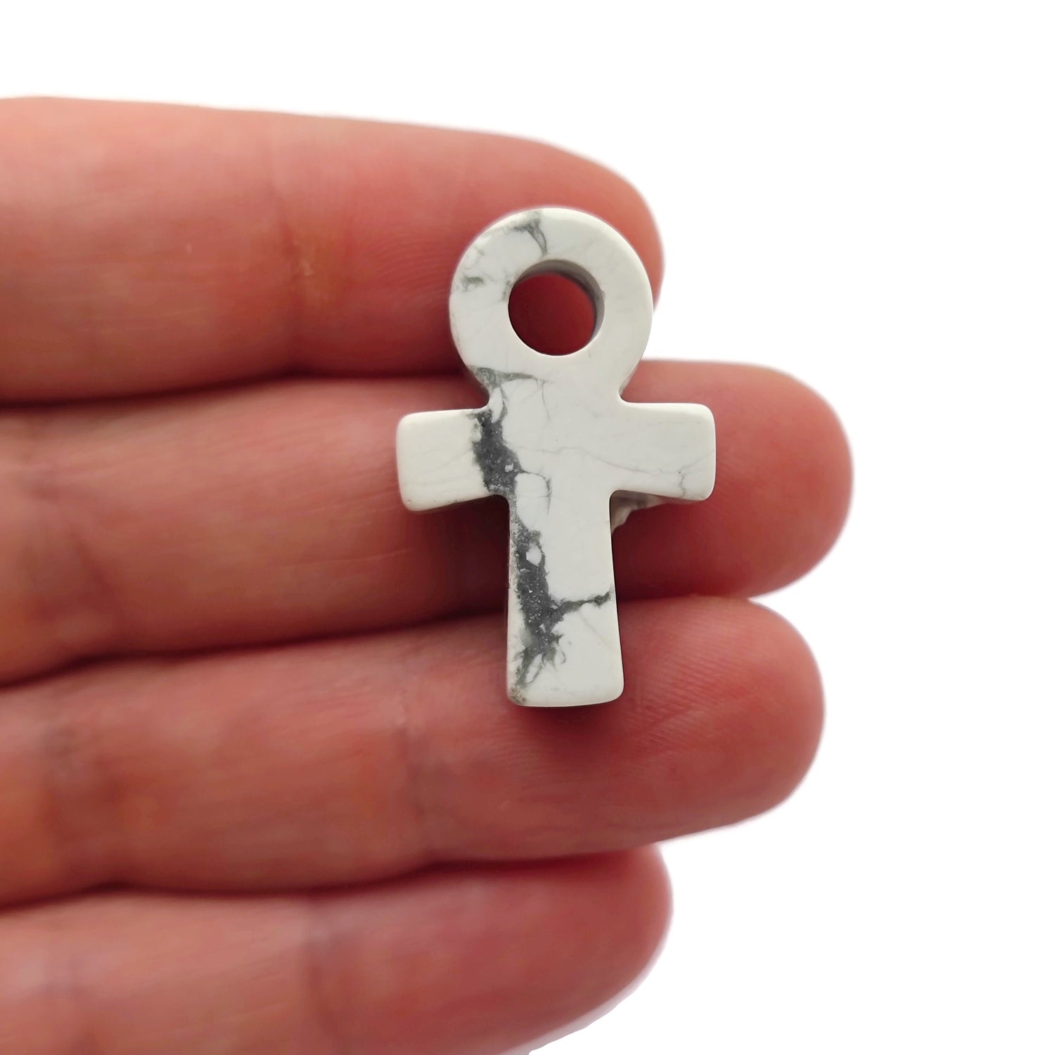 30mm Howlite Anka crystal carving with gemstone design, featuring elegant Ankh symbol, crafted by GemstoneGO.