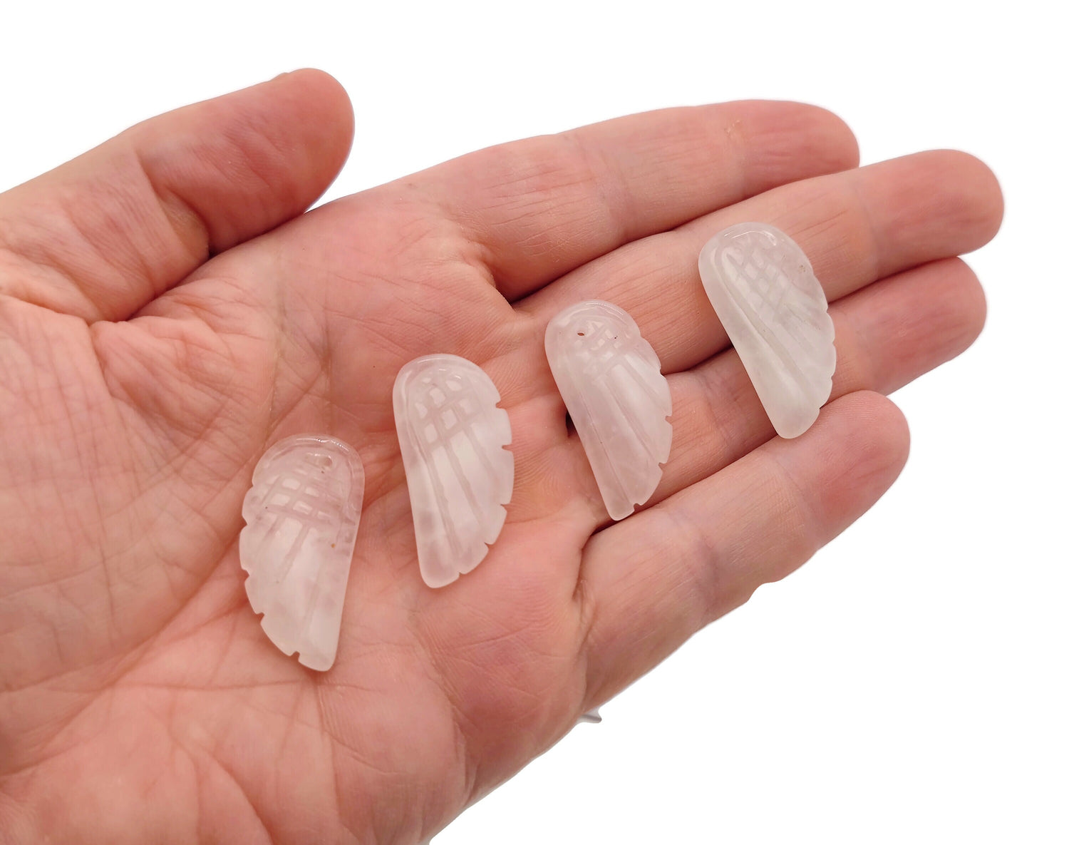 Rose quartz crystal angel wing pendant featuring carved angel wing design, gemstone jewelry with angel wing charm.