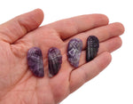 Amethyst angel wing crystal pendant with hole charm, showcasing a detailed purple gemstone wing on a silver chain.