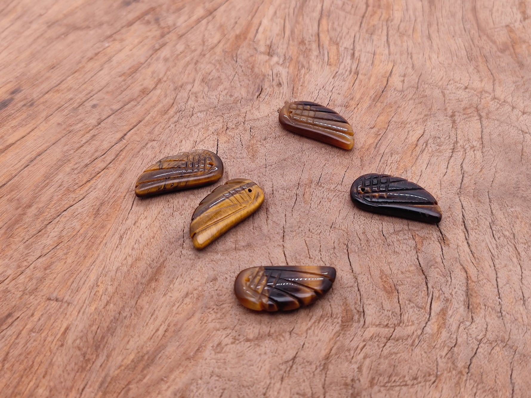 Tiger Eye angel wing crystal pendant with hole charm, showcasing warm golden-brown gemstone details and detailed wing design.