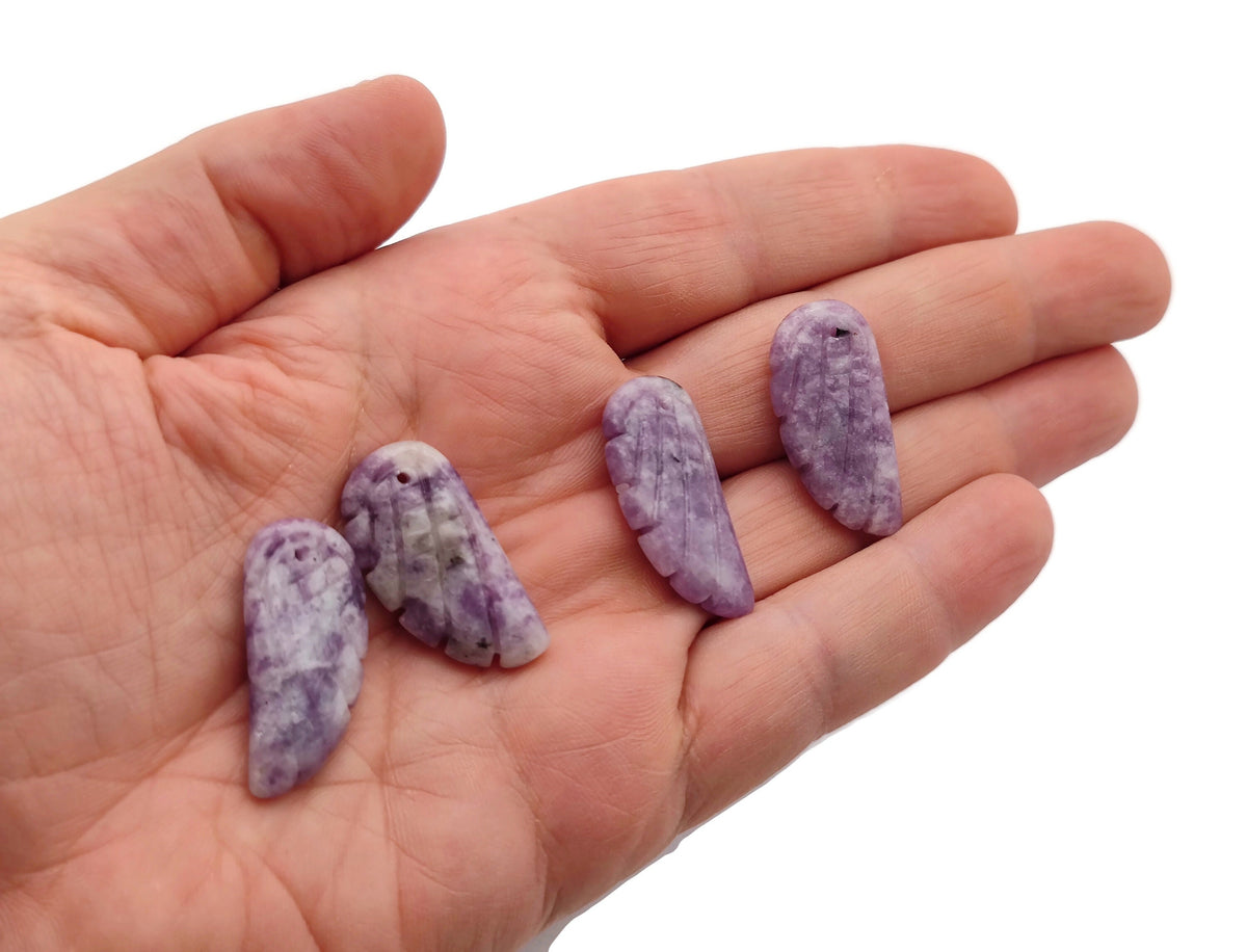 Lepidolite angel wing crystal pendant with hole charm, showcasing a purple gemstone wing and silver-toned bail.