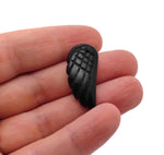Obsidian angel wing crystal pendant from GemstoneGO showing a detailed black stone angel wing charm with hole for necklace attachment.