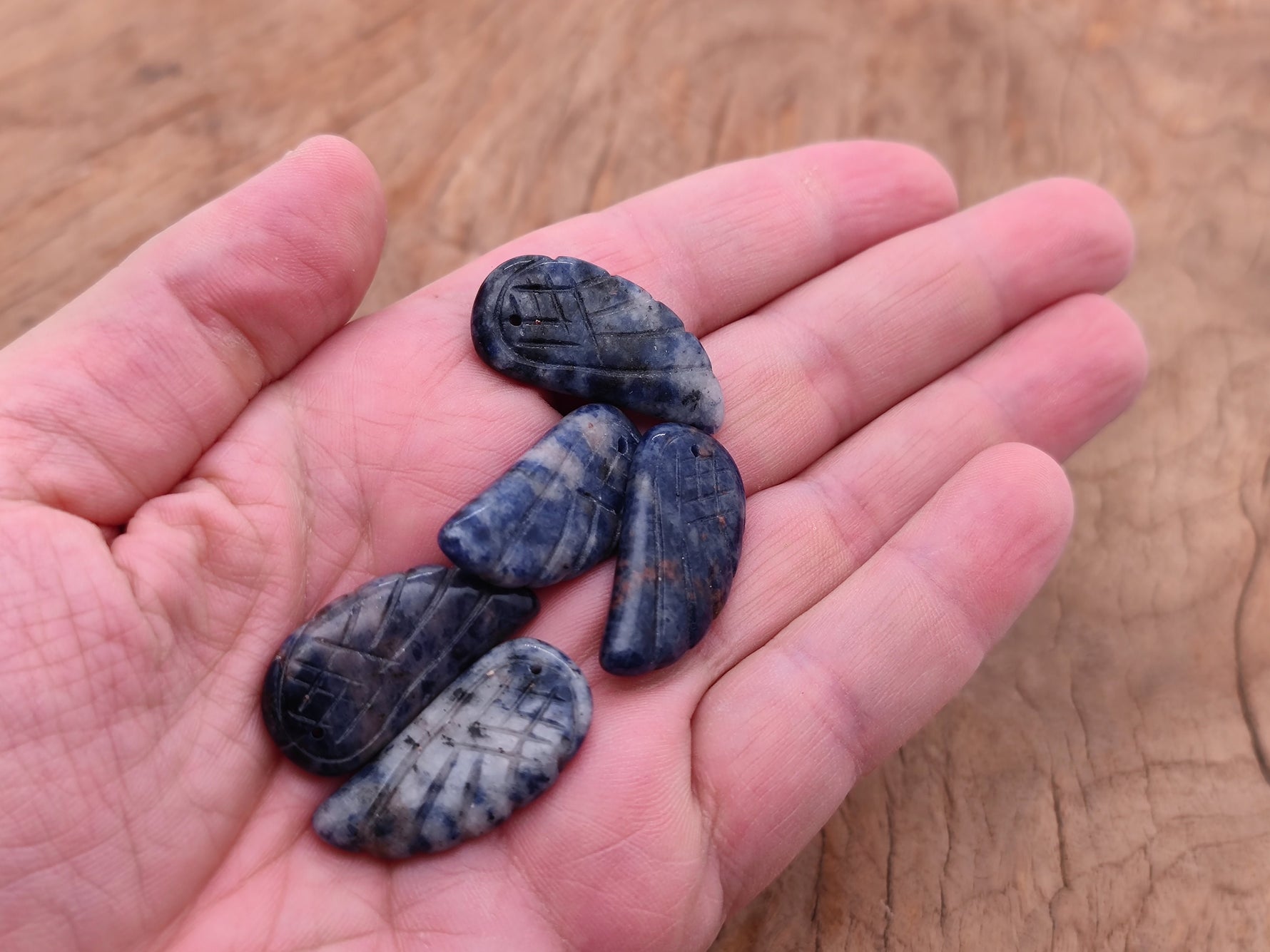 Sodalite angel wing crystal pendant with hole charm, featuring blue and white gemstone details, from GemstoneGO.
