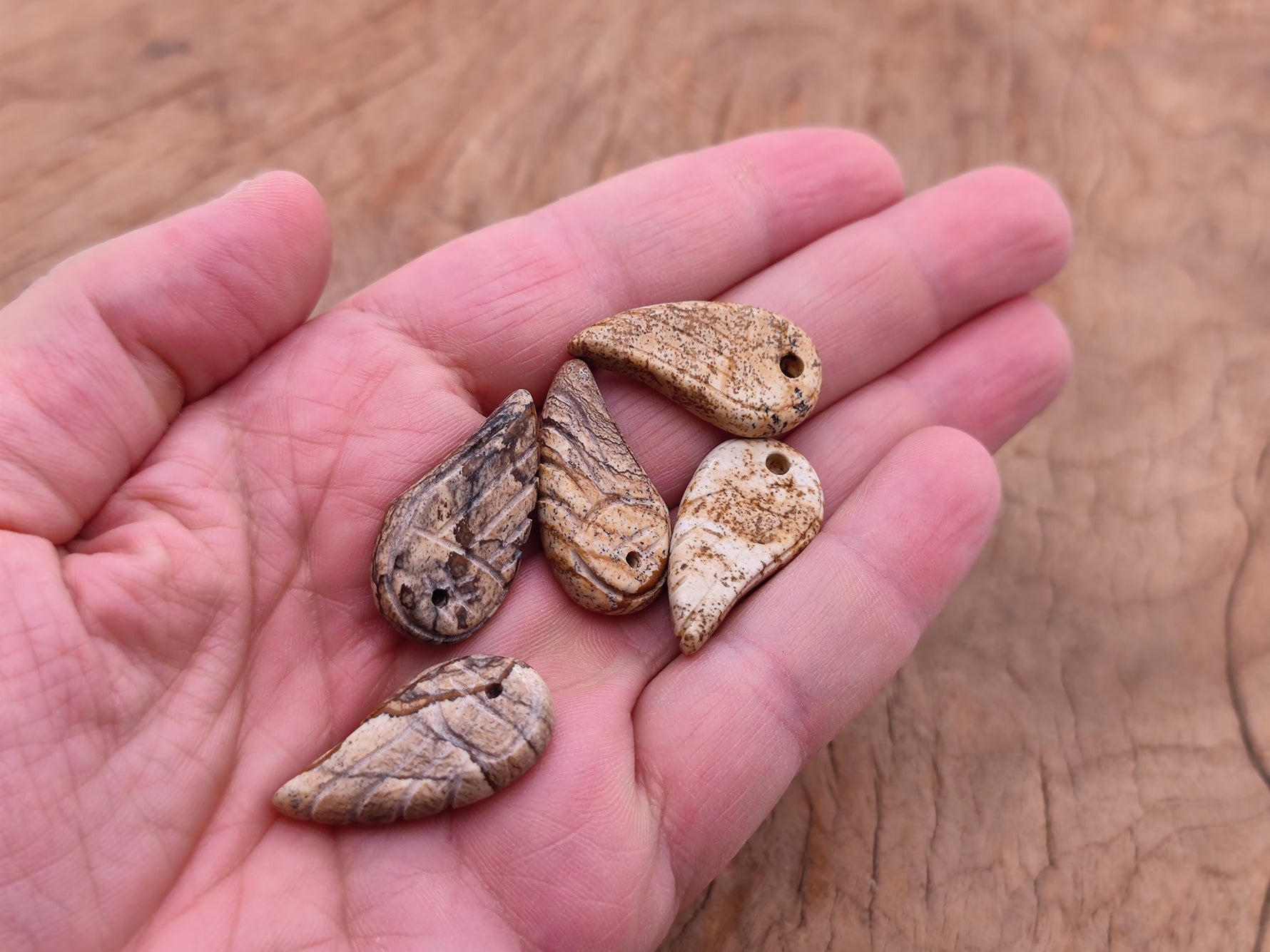 Picture Jasper angel wing crystal pendant with hole charm, featuring natural stone details and intricate wing design.