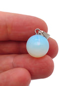 Opalite crystal ball pendant from GemstoneGO, round gemstone jewelry making pendant showcasing a smooth, glowing orb design.