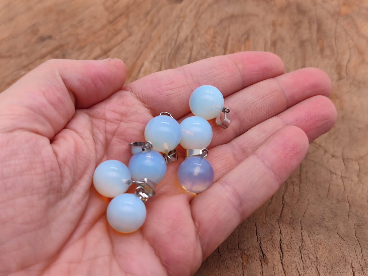 Opalite crystal ball pendant from GemstoneGO, smooth round gemstone jewelry making pendant with a luminous glow.