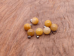 Yellow jade crystal ball pendant from GemstoneGO, round gemstone jewelry making pendant with polished smooth surface.