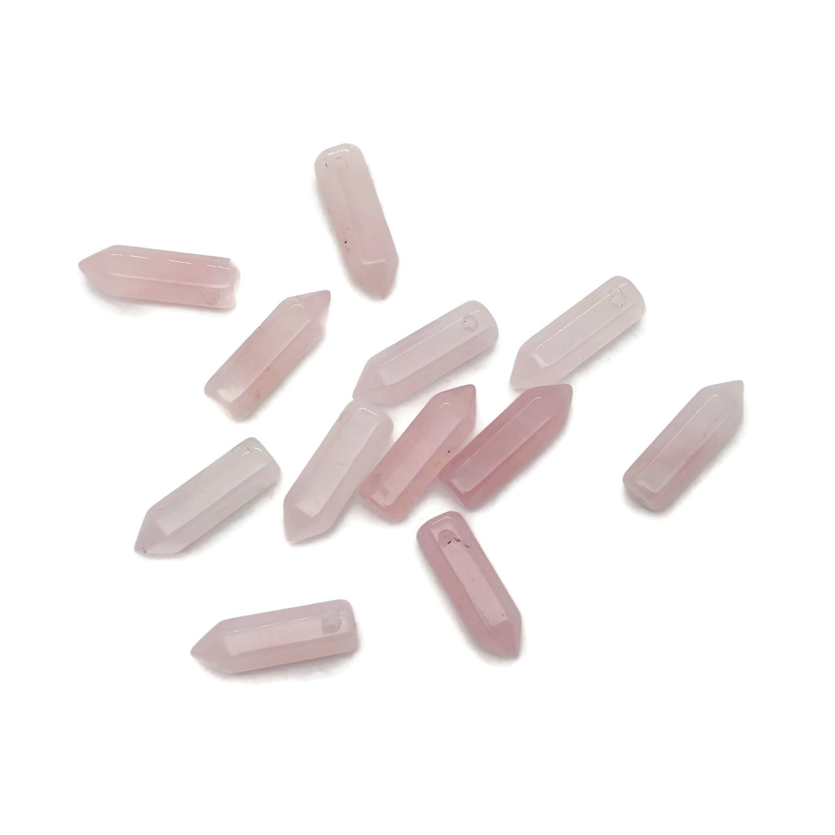 Rose quartz point crystal pendant with drilled hole, showcasing a polished pink gemstone from GemstoneGO.