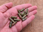 Unakite crystal point pendant with drilled hole, featuring natural green and pink mineral patterns, by GemstoneGO.