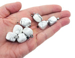 Howlite tumbled gemstone pendant by GemstoneGO, featuring a smooth, polished white stone with natural gray veining.