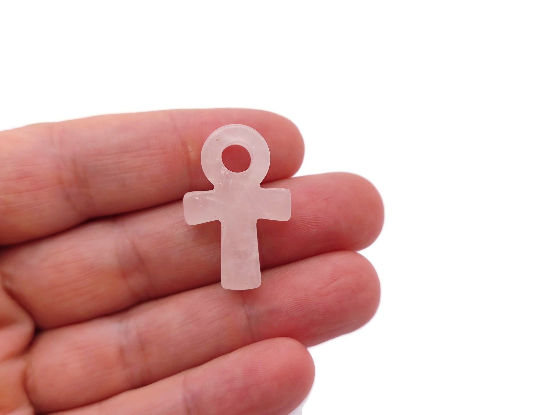 Rose Quartz Anka crystal carving from GemstoneGO featuring a 30mm gemstone ankh symbol, detailed and polished gemstone craftsmanship.