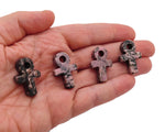 Rhodonite Anka crystal carving from GemstoneGO, 30mm gemstone gemstone with intricate Egyptian-inspired Ankh design.