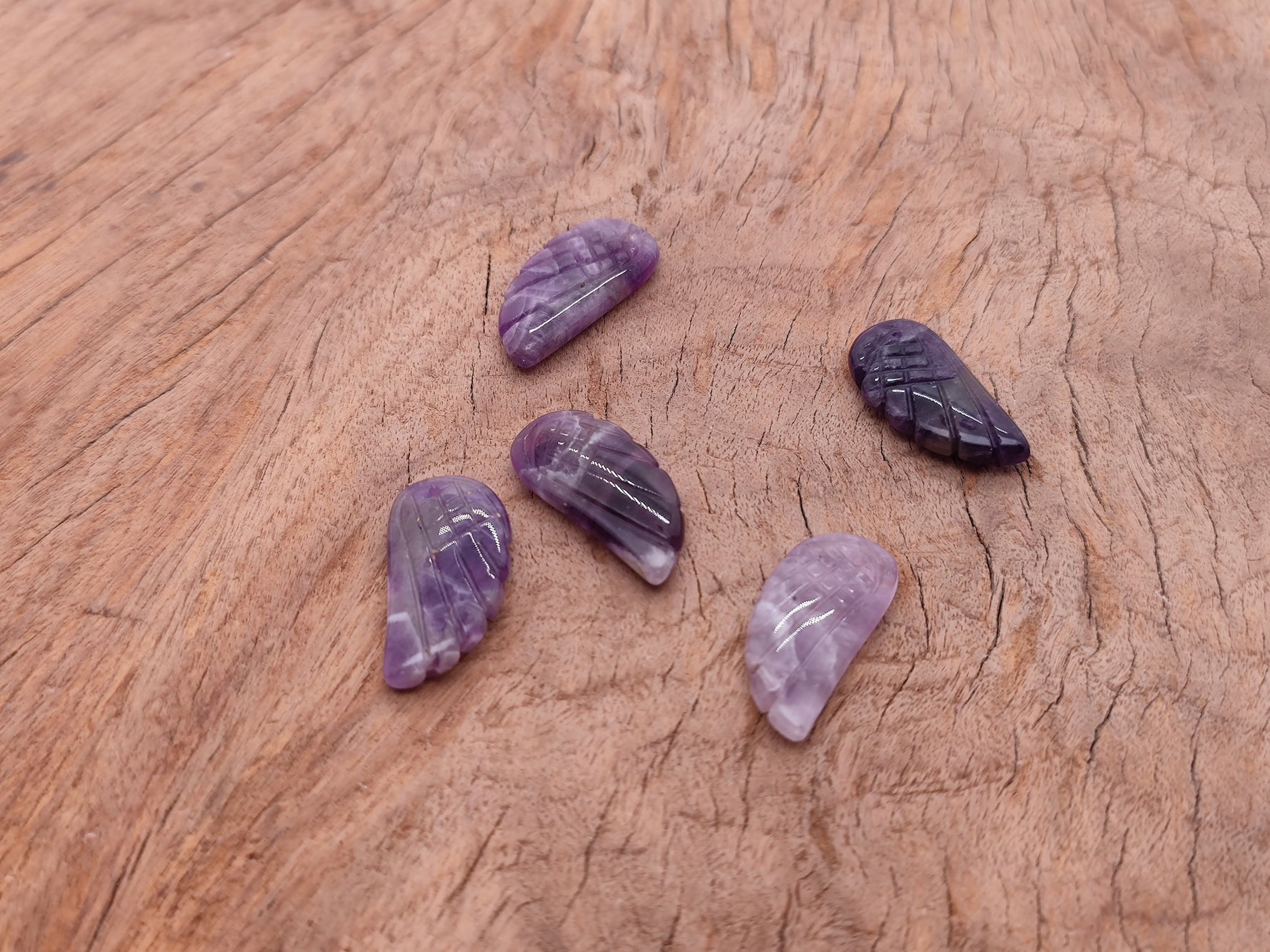 Amethyst angel wing crystal pendant with hole charm, featuring purple gemstone and detailed wing design by GemstoneGO