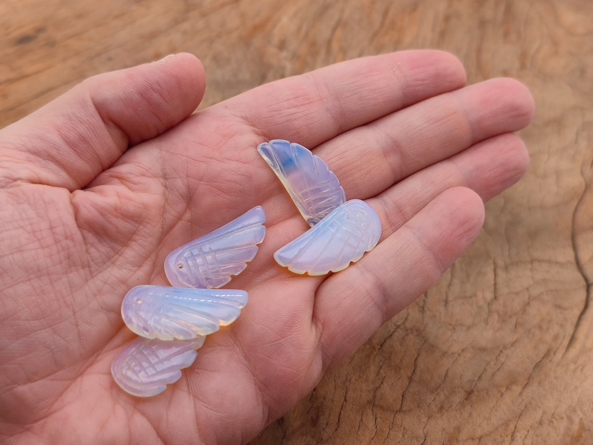 Opalite angel wing crystal pendant with hole charm, showcasing a shimmering angel wing design from GemstoneGO.