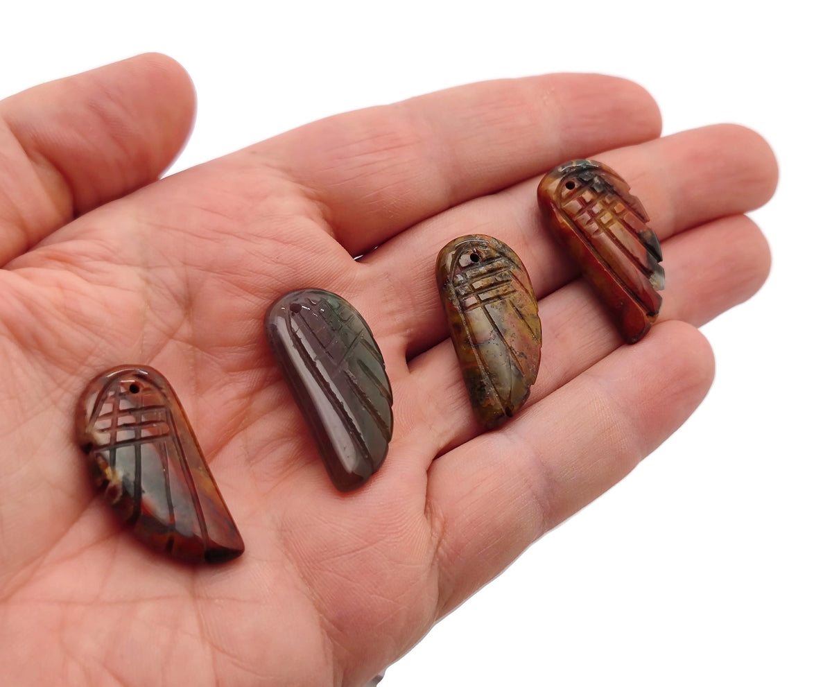 Indian Agate angel wing crystal pendant with hole charm, featuring detailed angel wing design and natural gemstone colors.