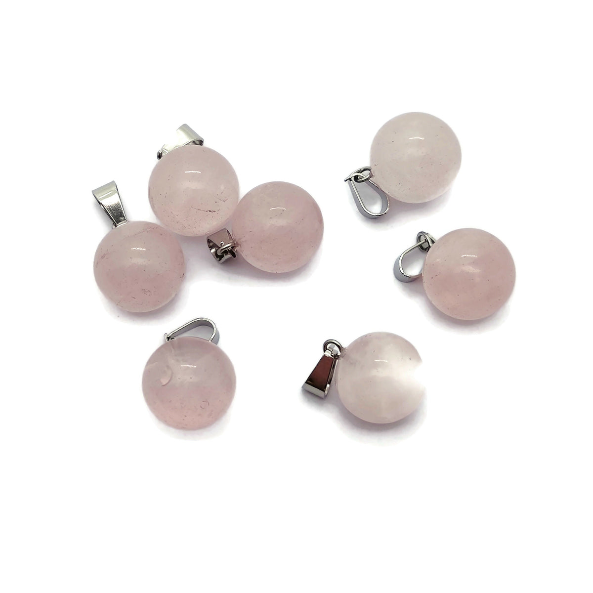 Rose quartz crystal ball pendant from GemstoneGO, featuring a smooth, round gemstone suitable for jewelry making.