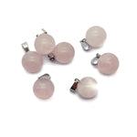 Rose quartz crystal ball pendant from GemstoneGO, featuring a smooth, round gemstone suitable for jewelry making.