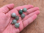 Around aventurine crystal ball pendant with a silver loop, suitable for jewelry making, featuring smooth, polished green gemstone.