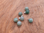 A round aventurine crystal ball pendant with silver bail, ideal for jewelry making and gemstone jewelry.