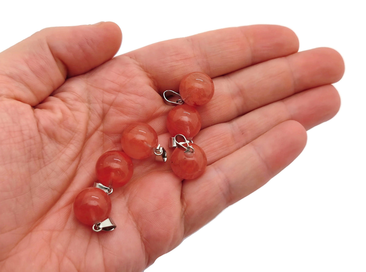 Cherry Quartz crystal round ball pendant from GemstoneGO, ideal for jewelry making, featuring a polished cherry quartz gemstone.