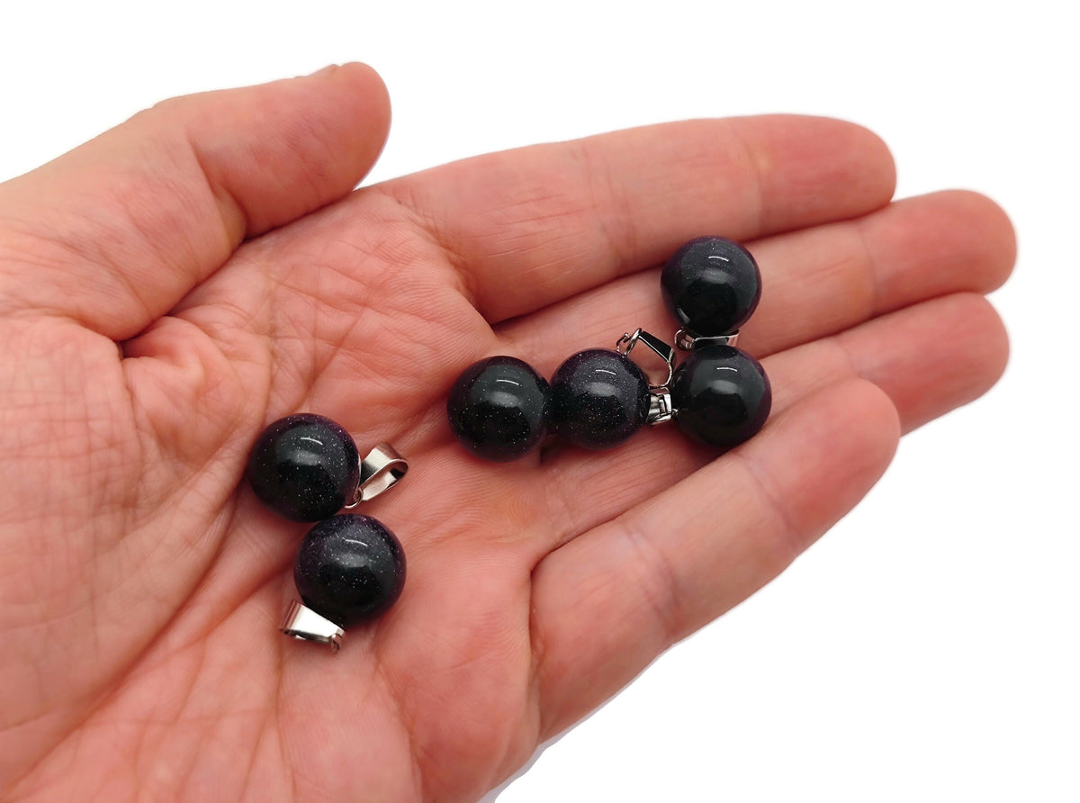Blue Goldstone round crystal ball pendant from GemstoneGO, showcasing a polished blue and gold speckled gemstone for jewelry making.
