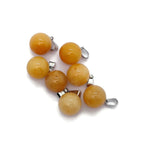 Yellow jade ball crystal pendant for jewelry making, featuring a round gemstone with a smooth polished surface.