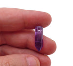 Amethyst point hole crystal pendant from GemstoneGO, showing a drilled purple amethyst crystal with natural facets and polished tip.