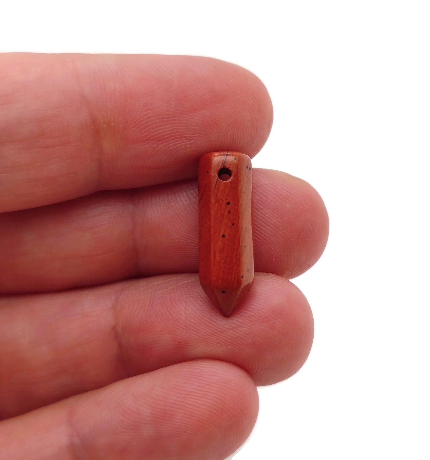 Red jasper point hole crystal pendant from GemstoneGO featuring a drilled red jasper crystal point for jewelry making.