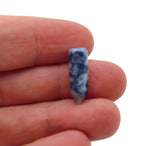 Blue Spot Jasper crystal pendant with drilled point, showcasing natural blue and black patterns in a polished gemstone from GemstoneGO.
