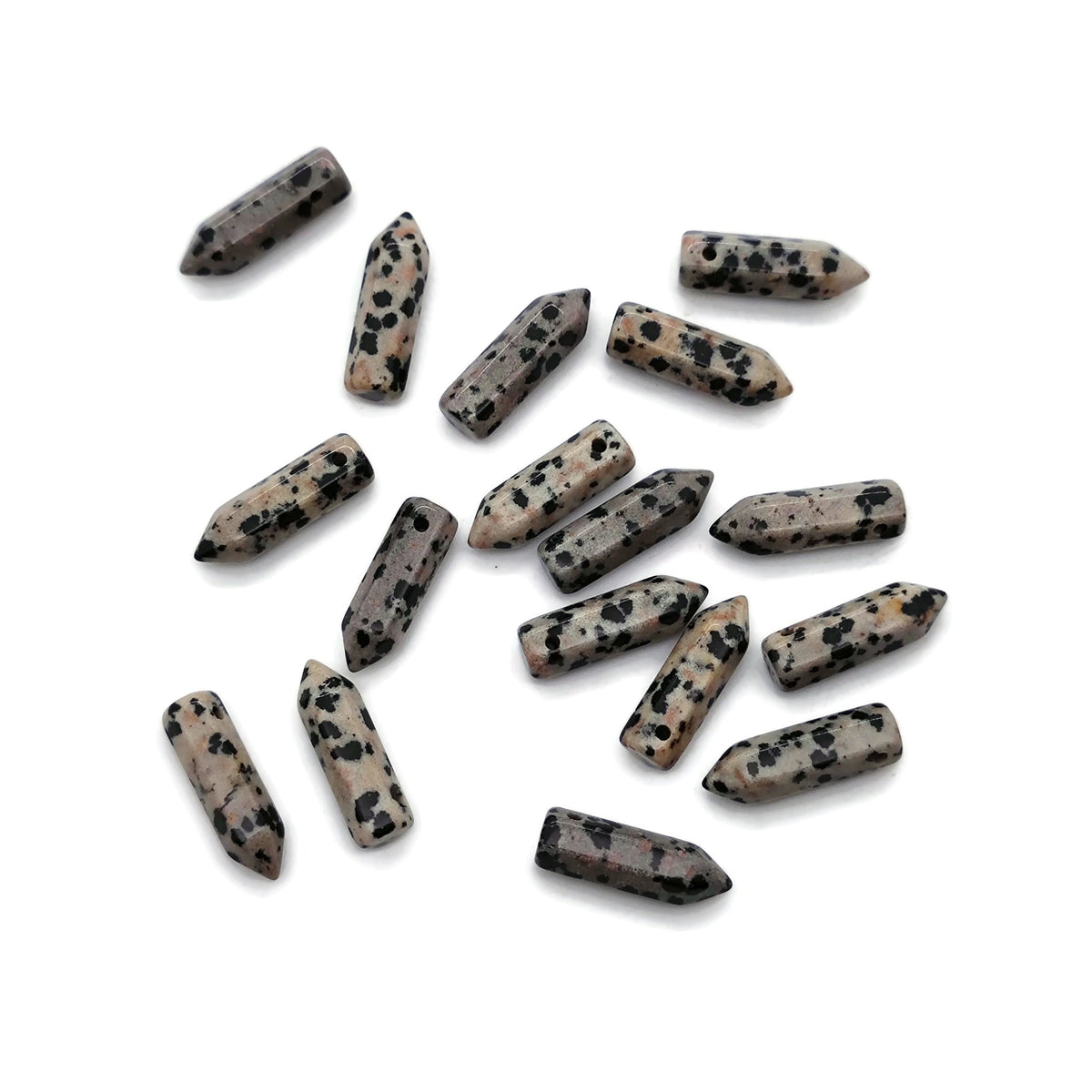 Dalmatian Jasper crystal point pendant drilled for jewelry, showcasing black spots on a light beige stone, from GemstoneGO.