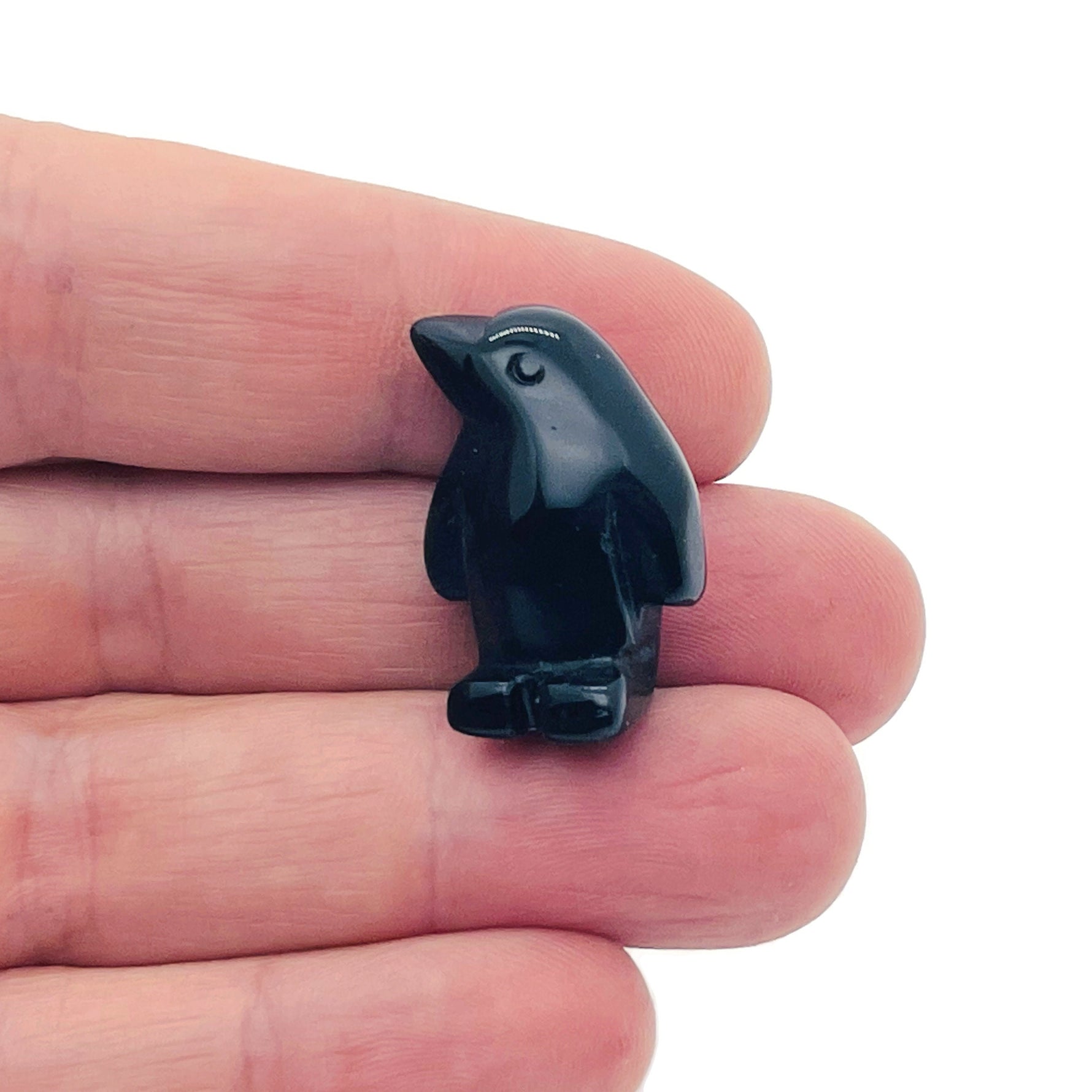 Handmade crystal penguin animal figure, carved gemstone decor, 30mm size, by GemstoneGO featuring a white and black gemstone design.