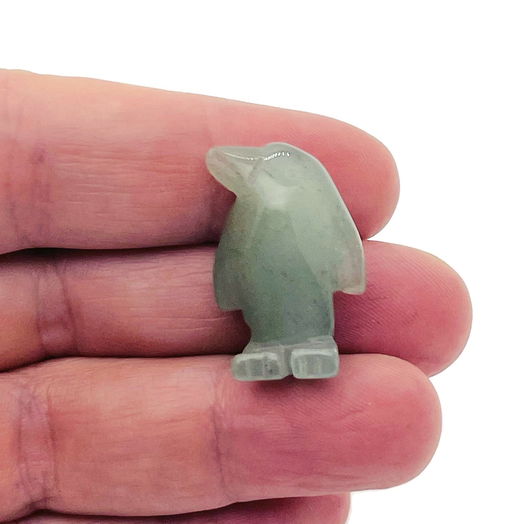 Handmade 30mm gemstone crystal penguin animal figure with carved details, showcasing a unique mix of colorful stones.