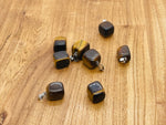 Tiger Eye tumbled gemstone pendant from GemstoneGO featuring a smooth, polished brown and gold stone on a simple chain.