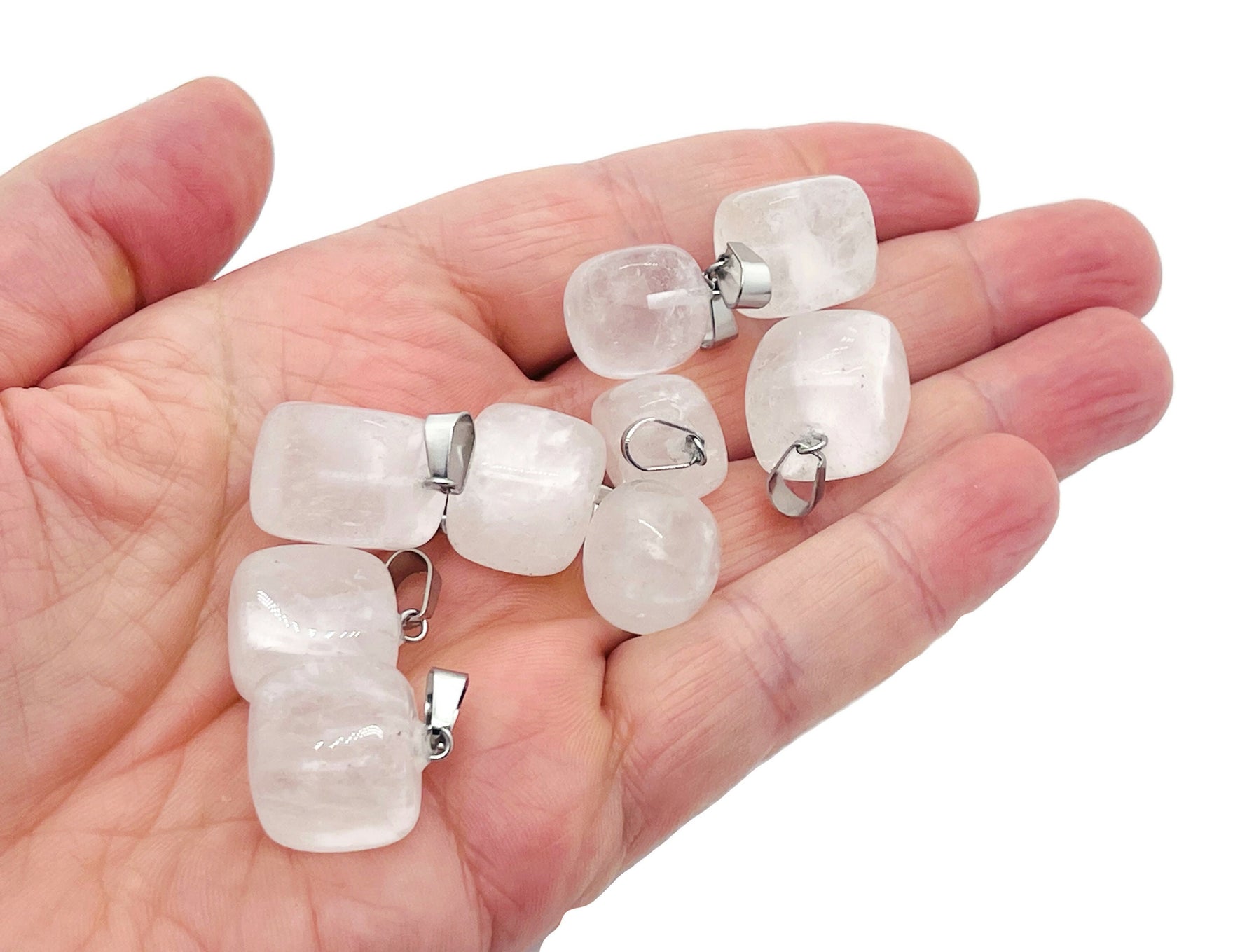 Clear Quartz tumbled gemstone pendant from GemstoneGO, showcasing a smooth, polished love stone with natural clarity and subtle facets.