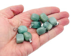 Aventurine tumbled gemstone pendant with a smooth, polished surface and natural green color, displayed on a neutral background.