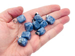 Blue Spot Jasper tumbled gemstone pendant featuring a vibrant blue and brown crystal design, ideal for jewelry and accessories.