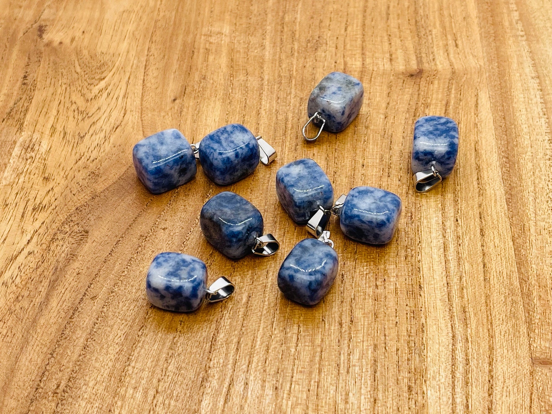 Blue Spot Jasper gemstone pendant by GemstoneGO, featuring a polished crystal with vibrant blue and brown spot patterns.